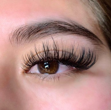 Designer wispy wet lash extensions Orange County - Natural glamorous wet look lashes professional OC salon